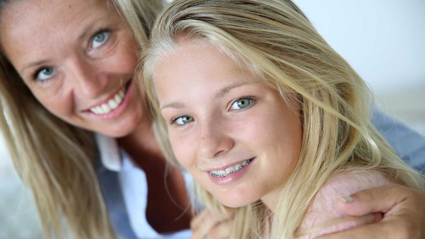 Mother And Daughter Smile At Camera Mother And Daughter Smile At Camera